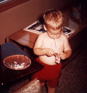 Rob at age 2, lighting up.
